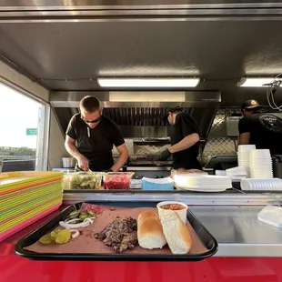 a man preparing food in a food truck