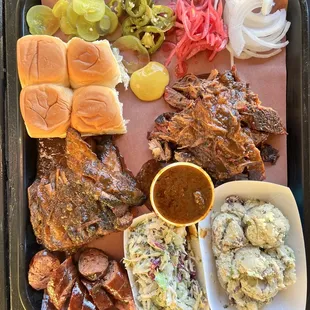 4 meat plate- tri-tip, briskets and sausage. Sides- potatoes salad and coleslaw.