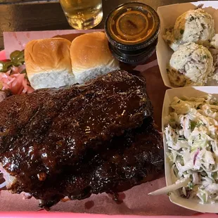 Full rack ribs meal with rolls, slaw, and potato salad ($49)