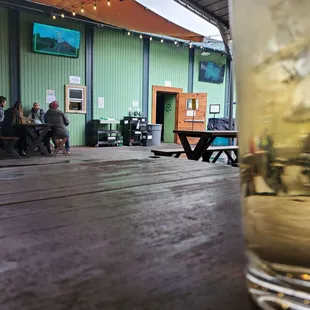 a glass of water on a wooden table