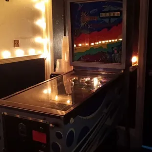 Pinball machine and complimentary water nearby