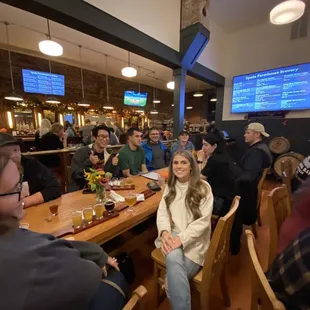 a group of people sitting at a bar