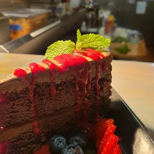 Chocolate Mousse cake with raspberry puree drizzle