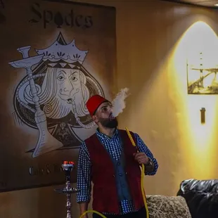 a man with a pipe smoking a hook