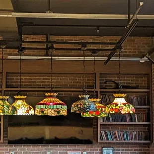 a restaurant with a brick wall