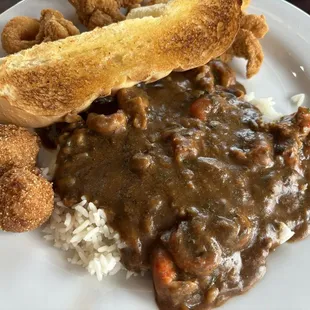 Crawfish stew with fried catfish chips and hush puppies