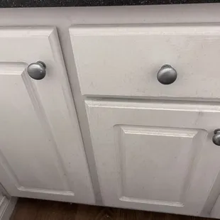Dirty bathroom cabinet from leaking ceiling
