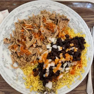 Pulled pork, yellow rice with black beans and onions