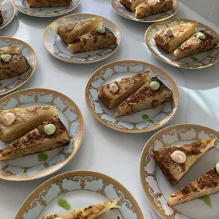 Traditional Spanish tortilla topped with green garlic and red pepper aioli