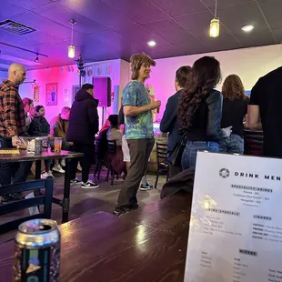 a group of people at a bar