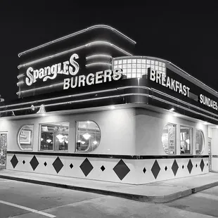 a black and white photo of a restaurant