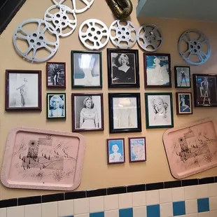 a wall full of pictures of movies