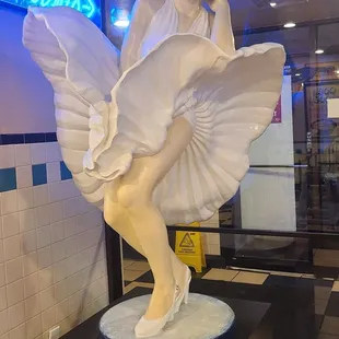 a statue of a woman in a white dress