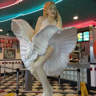 a statue of a woman in a white dress