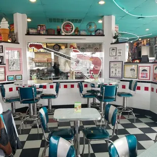 the interior of a diner with a checkered floor