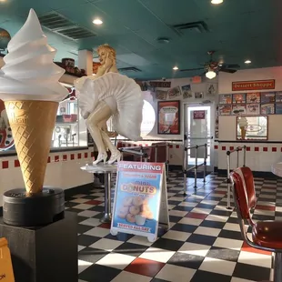 the interior of a diner with a statue of a man riding a horse
