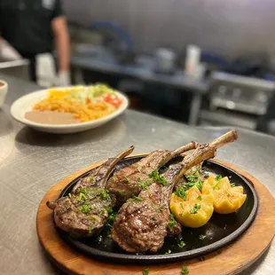 a plate of lamb chops