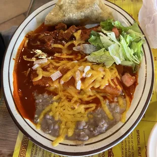 No. 3 one tamale one enchilada one taco fries beans Chile con carne lettuce and tomato