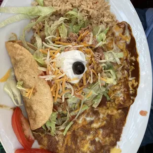 Combo plate: chicken tostada, beef taco, cheese enchilada.