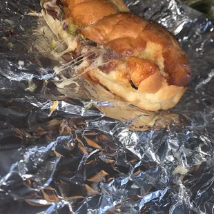 a sandwich wrapped in tin foil