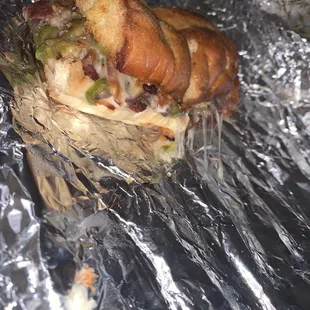 a sandwich wrapped in tin foil