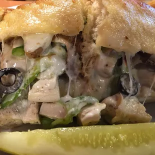 The chicken sandwich loaded up with veggies.