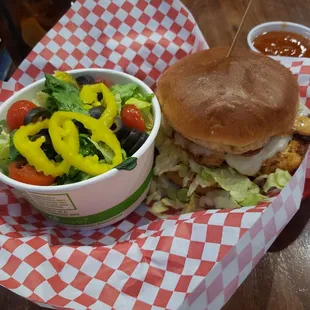 Grilled Cajun chicken sandwich and side salad