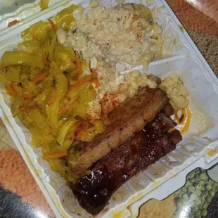 Fried cabbage, ribs and potato salad. Ribs are smoky and slide off the bone quite easily. Apologies for the messy box it flipped in transit.