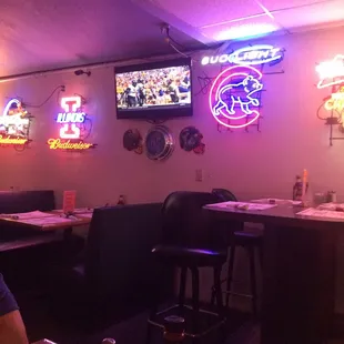 a restaurant with neon signs
