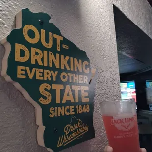 a person holding a drink