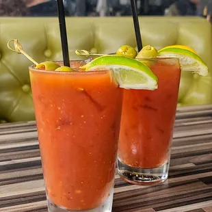 two bloody drinks on a table