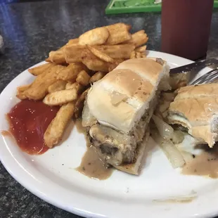 a plate with a sandwich and french fries