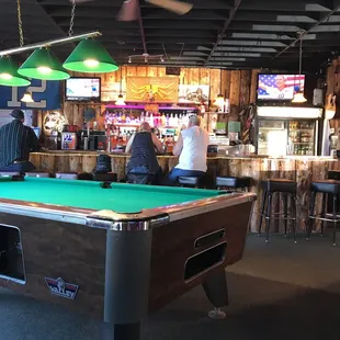 a pool table in a bar