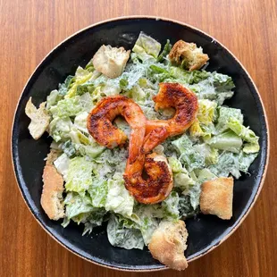 Cesar Salad with grilled shrimp added.