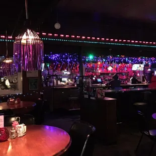 a bar with christmas lights