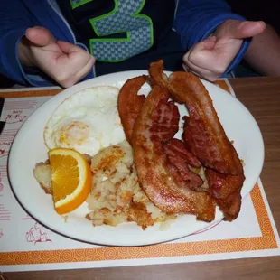 Eggs, hashbrowns, and bacon get two thumbs up