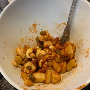 a bowl of food with a fork in it