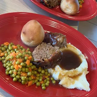Blazing meatloaf, mashed potatoes, peas, and carrots