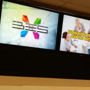 Overhead monitors to keep track of the score.