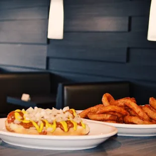 a hot dog and fries on a table