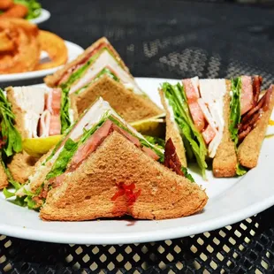 a plate of sandwiches and chips