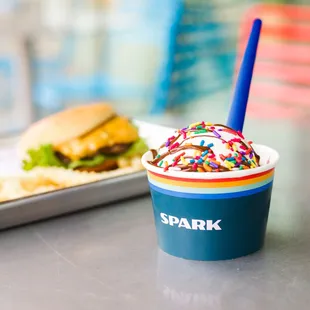 a cup of ice cream with sprinkles