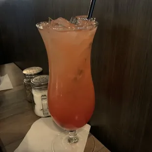 a cocktail in a tall glass