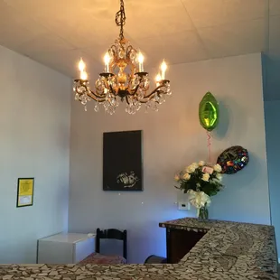 Cash wrap area with 1941 chandelier from a friend&apos;s home