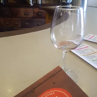 a wine glass and menu