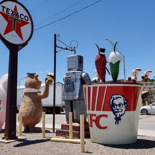a statue of a man and a cow