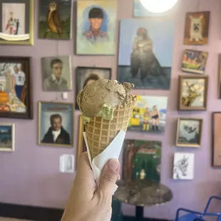 Matcha and cookies and cream on a waffle cone