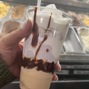 Coffee ice cream, Lavender honey ice cream on top, Hot fudge between, Topped w/almonds, mallo cream, whipped cream, &amp; choc chips