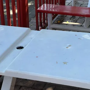 a white table with a hole in it