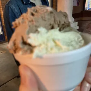 a man holding a bowl of ice cream